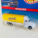 1997 Hot Wheels Haulers Milk Dudes Caramels Camión Cisterna blanco con amarillo 7SP