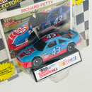 1991 Racing Champions Stock Car NASCAR Richard Petty 43 STP Pontiac Grand Prix celeste Llantas Goodyear