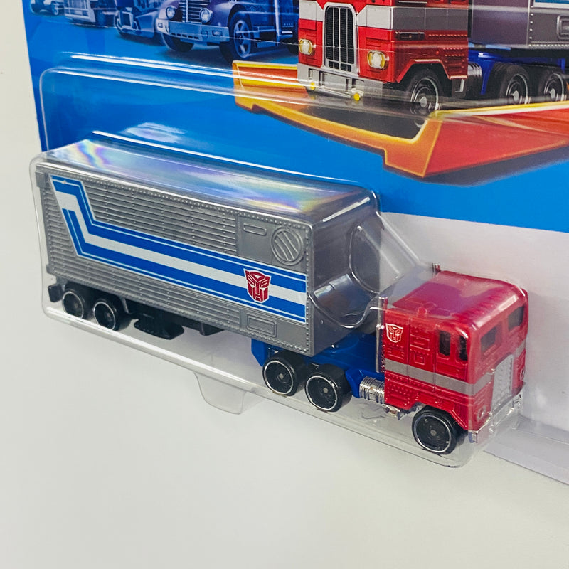 2024 Hot Wheels Track Fleet Transformers Optimus Prime rojo DD8 Primer