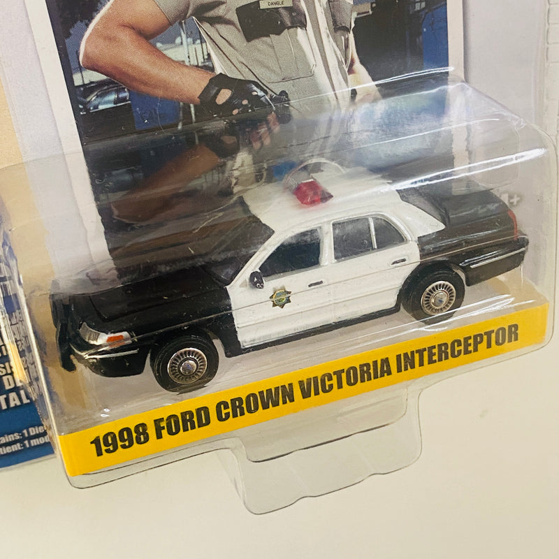 2022 Greenlight Hollywood Reno 911! Jim Dangle 1998 Ford Crown Victoria Police Interceptor negro con blanco Llantas de Goma