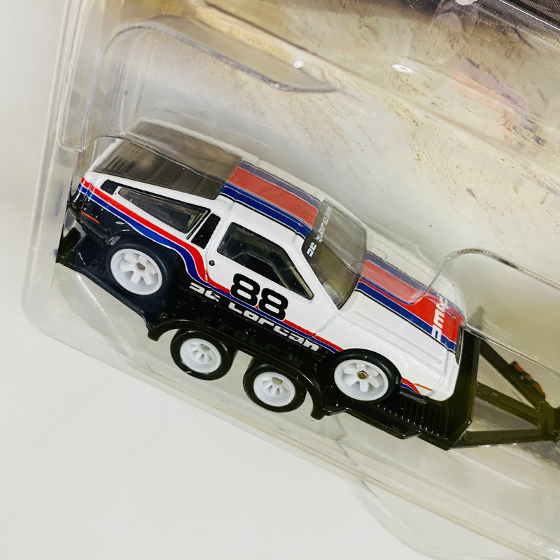 2025 Hot Wheels Premium Car Culture Team Transport DMC DeLorean en Trailer y HW Rally Hauler con Llantas de Goma RR