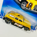 2009 Hot Wheels HW City Works Cockney Cab II dorado con negro OH5 base ZAMAC - Detalle Burbuja