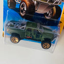 2010 Hot Wheels New Models Sandblaster 2010 Ford F-150 SVT Raptor verde oliva camuflado militar 5SP Primera Edición
