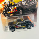 2026 Matchbox MBX Metro 2024 GMC Sierra 3500 Wrecker negro Primera Edición con Grúa Móvil