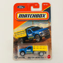 2025 Matchbox MBX Construction Ford F-350 Stake Bed Truck azul con Plataforma Móvil
