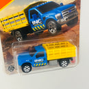 2025 Matchbox MBX Construction Ford F-350 Stake Bed Truck azul con Plataforma Móvil
