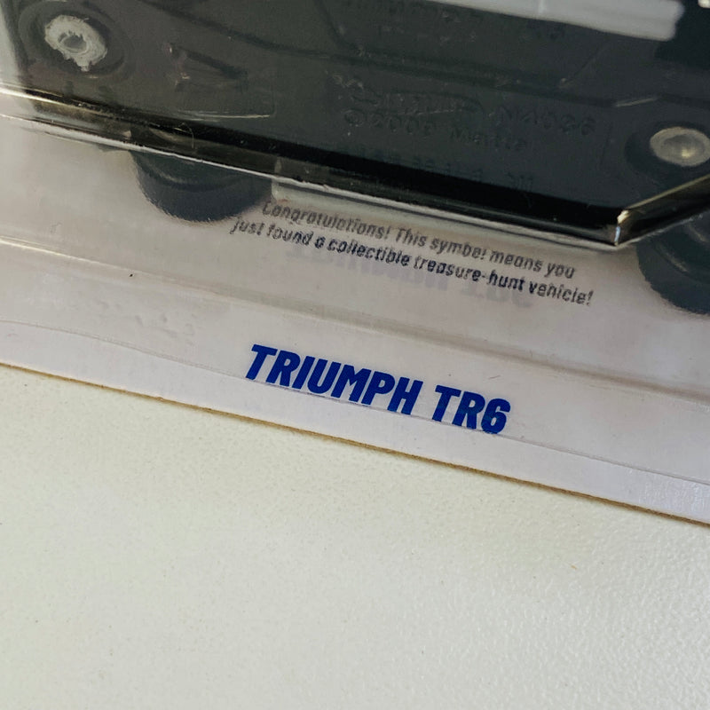 2025 Hot Wheels Treasure Hunt HW Track Champs Triumph TR6 gris DD8