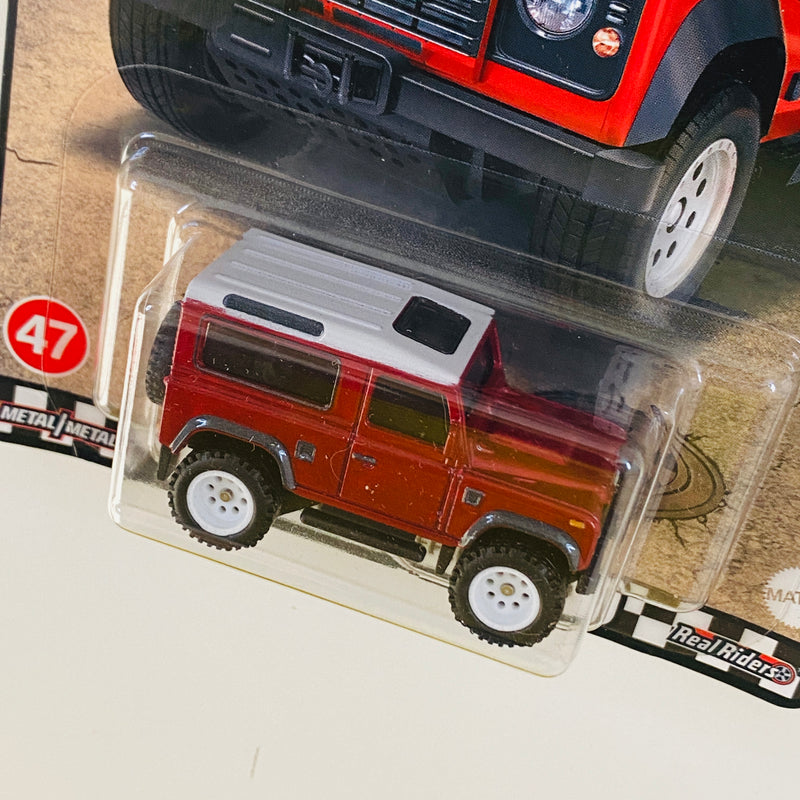 2022 Hot Wheels Premium Boulevard Land Rover Defender 90 rojo metálico Llantas de Goma RR