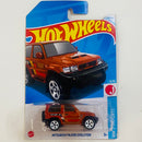2024 Hot Wheels HW J-Imports Mitsubishi Pajero Evolution naranja metálico 5SP - Básico del STH