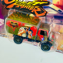 2018 Hot Wheels Premium Pop Culture Street Fighter V CAPCOM Guile vs M. Bison 88 Mercedes Benz Unimog U1300 verde Llantas de Goma RR base ZAMAC