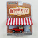 2021 Greenlight The Hobby Shop Series 12 1975 Nissan Patrol with Backpacker rojo Llantas de Goma con Figura Diorama