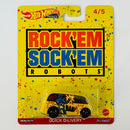 2022 Hot Wheels Premium Pop Culture Mattel Brands Rock 'Em Sock 'Em Robots Quick D-Livery amarillo Llantas de Goma RR base ZAMAC
