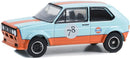 2023 Greenlight GULF Special Edition Series 1 1974 Volkswagen GOLF GTI celeste con naranja Llantas de Goma