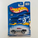 2001 Hot Wheels First Editions Mega-Duty 038 plata PR5 base ZAMAC