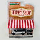 2022 Greenlight The Hobby Shop Series 14 2021 Ford Bronco Wildtrak with Spare Tires blanco Llantas de Goma con Accesorio Diorama